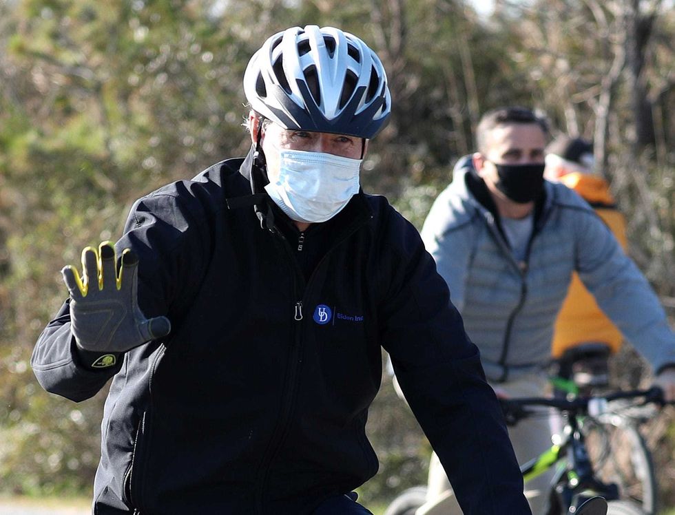 U.S. President Elect Joe Biden takes a bike ride through Cape Henlopen State Park on November 14, 2020 in Lewes, Delaware. President Elect Biden has been staying at a vacation home in Rehoboth Beach while working on his transition.
