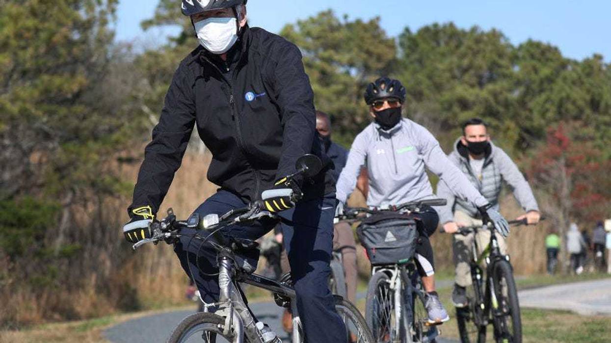 U.S. President Joe Biden and his wife Jill Biden take a bike ride through Cape Henlopen State Park on November 14, 2020 in Lewes, Delaware.