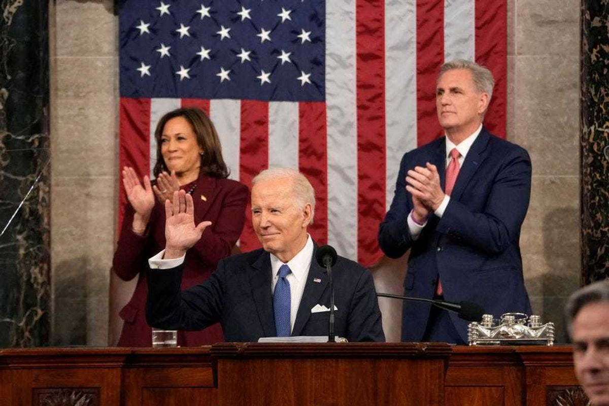 U.S. President Joe Biden arrives to deliver the State of the Union address to a joint session of Congress as Vice President Kamala Harris and House Speaker Kevin McCarthy (R-CA) applaud on February 7, 2023 in the House Chamber of the U.S. Capitol in Washington, DC.