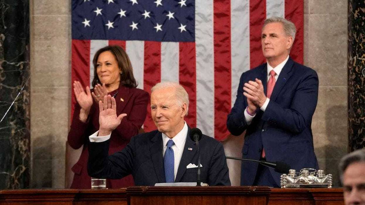 U.S. President Joe Biden arrives to deliver the State of the Union address to a joint session of Congress as Vice President Kamala Harris and House Speaker Kevin McCarthy (R-CA) applaud on February 7, 2023 in the House Chamber of the U.S. Capitol in Washington, DC.