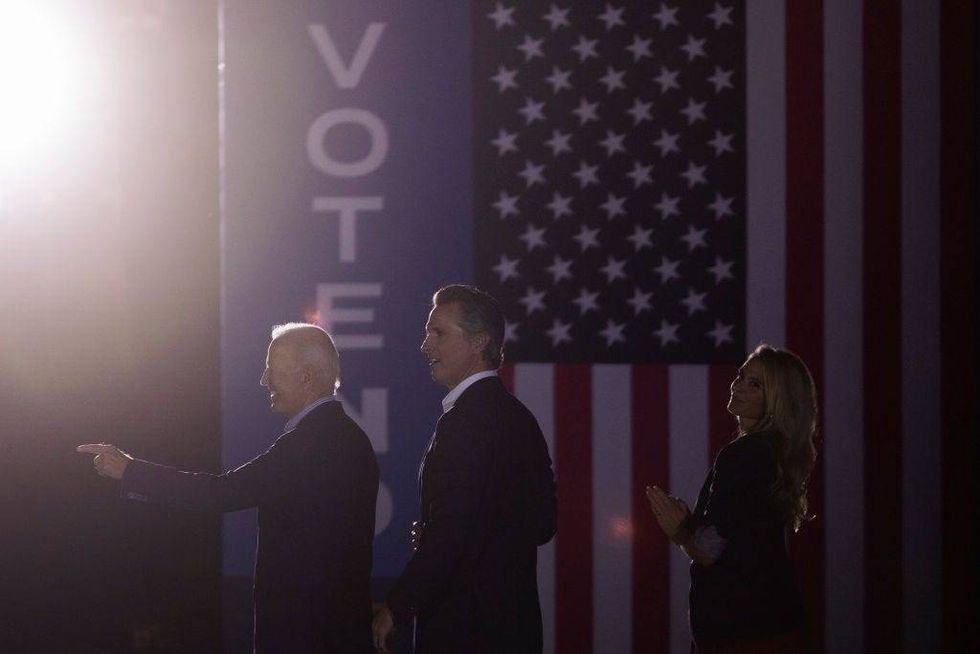 U.S. President Joe Biden, California Gov. Gavin Newsom and Jennifer Lynn Siebel Newsom wave to the crowd as they campaign to keep the governor in office at Long Beach City College on the eve of the last day of the special election to recall the governor on September 13, 2021 in Long Beach, California.