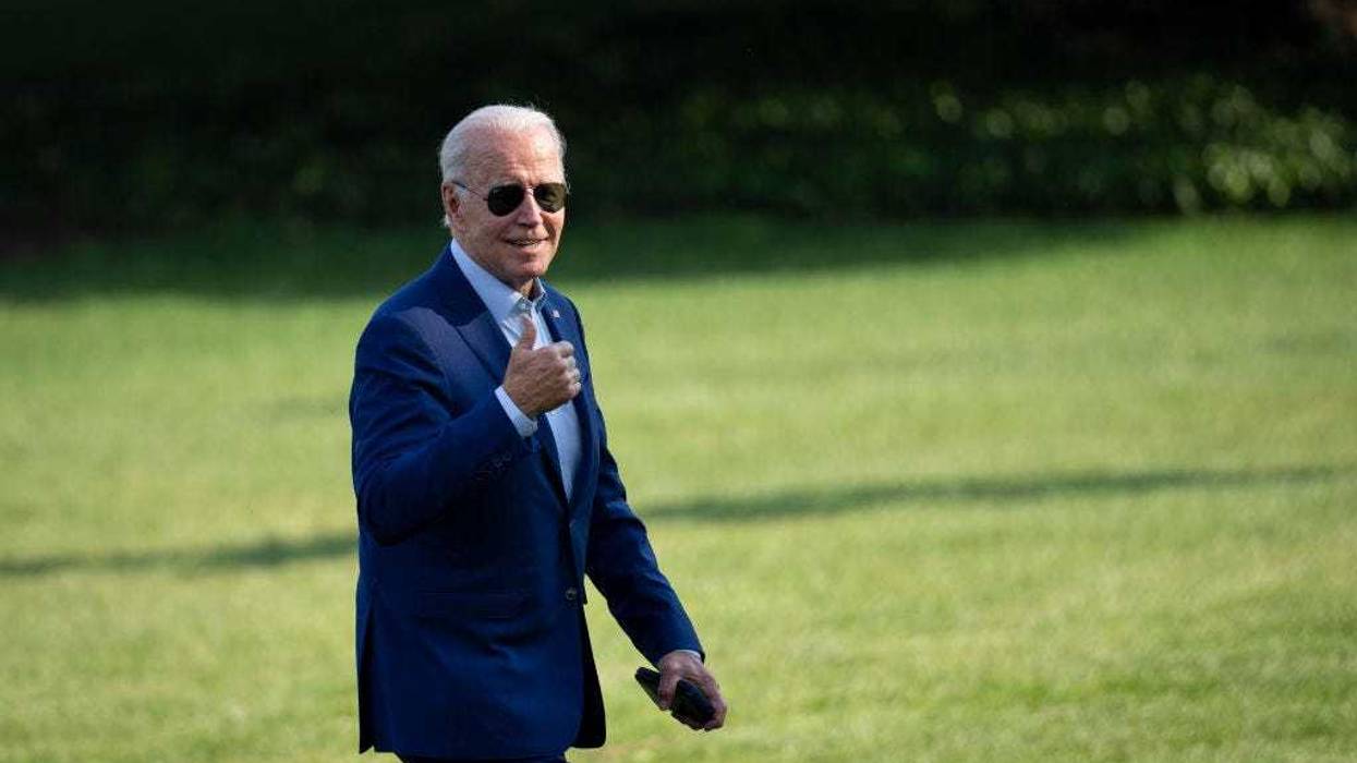 U.S. President Joe Biden gestures toward reporters as he departs Marine One and walks to the Oval Office on the South Lawn of the White House July 20, 2022 in Washington, DC.