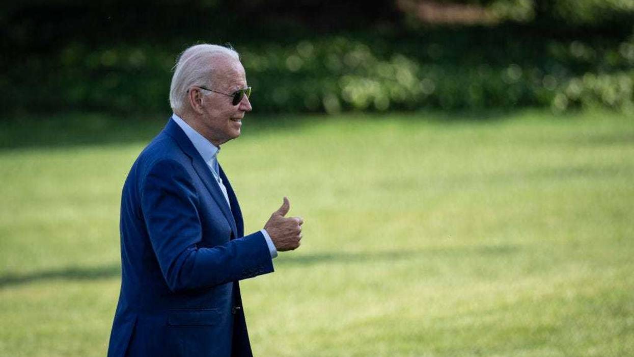U.S. President Joe Biden gestures toward reporters as he departs Marine One and walks to the Oval Office on the South Lawn of the White House July 20, 2022 in Washington, DC.
