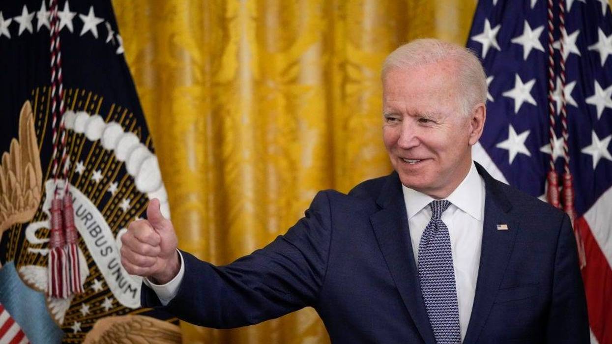 U.S. President Joe Biden gives the thumbs up to the audience before signing the Juneteenth National Independence Day Act into law in the East Room of the White House on June 17, 2021 in Washington, DC.