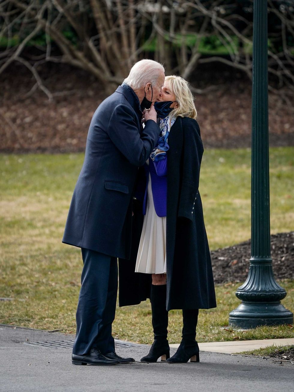 U.S. President Joe Biden kisses his wife first lady Dr. Jill Biden as he walks to Marine One on the South Lawn of the White House on January 29, 2021 in Washington, DC. President Biden is traveling to Walter Reed National Military Medical Center to visit with wounded service members.