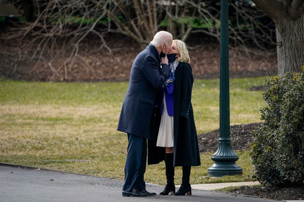 U.S. President Joe Biden kisses his wife first lady Dr. Jill Biden as he walks to Marine One on the South Lawn of the White House on January 29, 2021 in Washington, DC. President Biden is traveling to Walter Reed National Military Medical Center to visit with wounded service members.