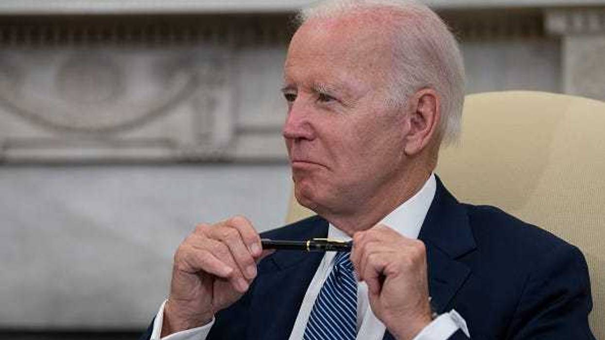 U.S. President Joe Biden listens to Mexican President Andres Manuel Lopez Obrador as they talk to journalists in the Oval Office at the White House on July 12, 2022 in Washington, DC.