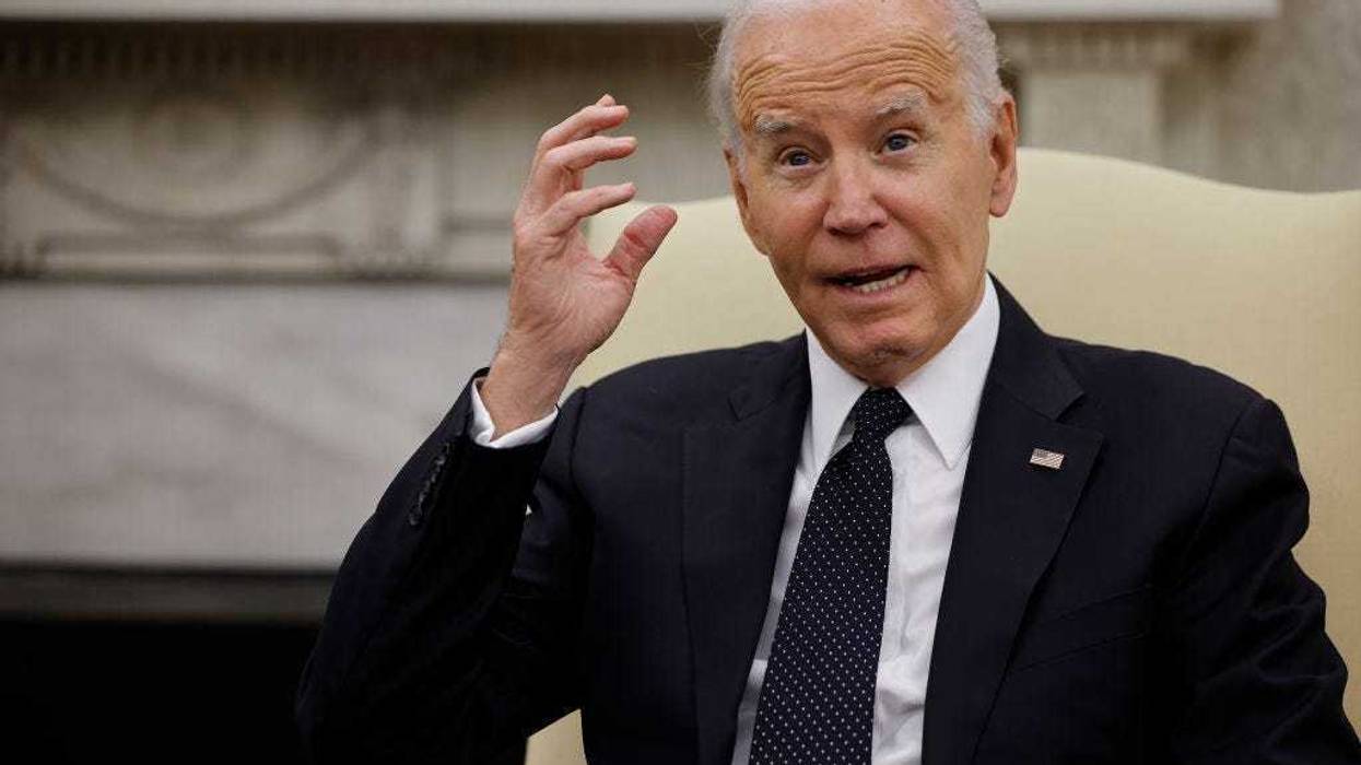 U.S. President Joe Biden speaks to reporters as he hosts Romanian President Klaus Iohannis in the Oval Office at the White House on May 07, 2024 in Washington, DC.