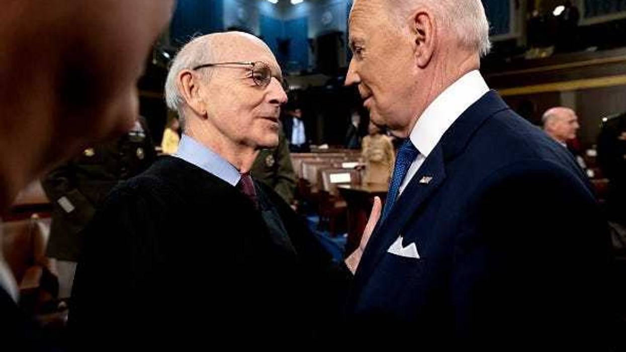 U.S. President Joe Biden speaks with Supreme Court Justice Stephen Breyer after delivering the State of the Union in the U.S. Capitol House Chamber on March 1, 2022 in Washington, DC.