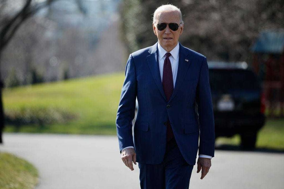 U.S. President Joe Biden walks over to journalists to talk about new Russian sanctions as he departs the White House on February 20, 2024 in Washington, DC. Biden is traveling to California to attend campaign receptions across the state.