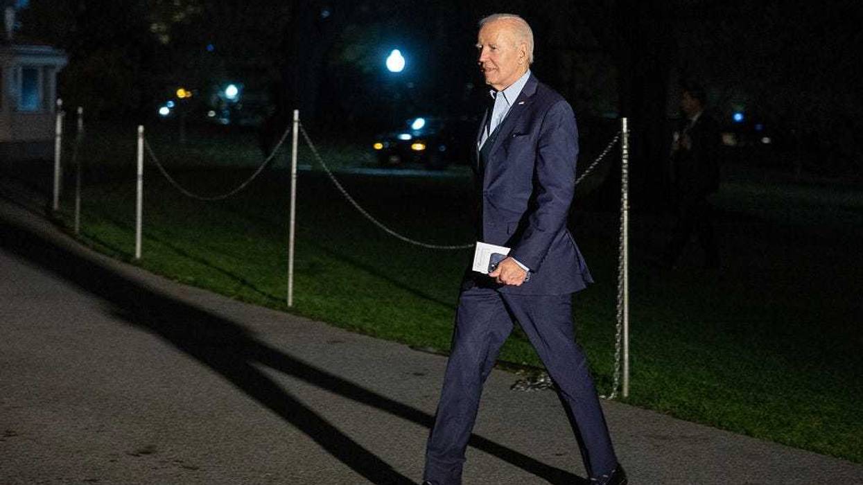 U.S. President Joe Biden walks to the White House after landing on the South Lawn aboard Marine One on November 06, 2022 in Washington, DC.