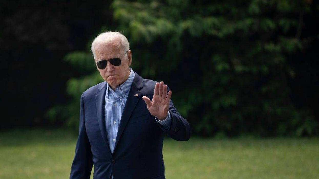 U.S. President Joe Biden waves as he walks to Marine One on the South Lawn of the White House on July 21, 2021. He was headed to Cincinnati, OH.