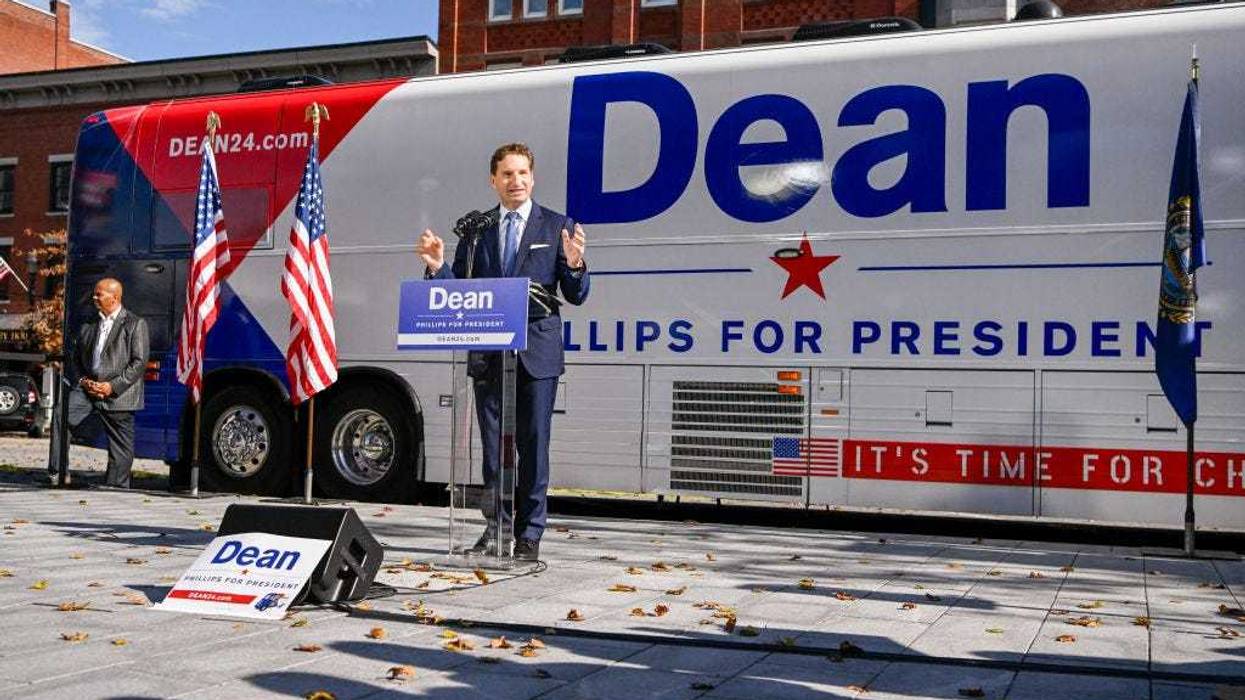 U.S. Rep. Dean Phillips (D-MN)(R) holds a rally outside of the N.H. Statehouse after handing over his declaration of candidacy form for President to the New Hampshire Secretary of State David Scanlan, on October 27, 2023 in Concord, New Hampshire.