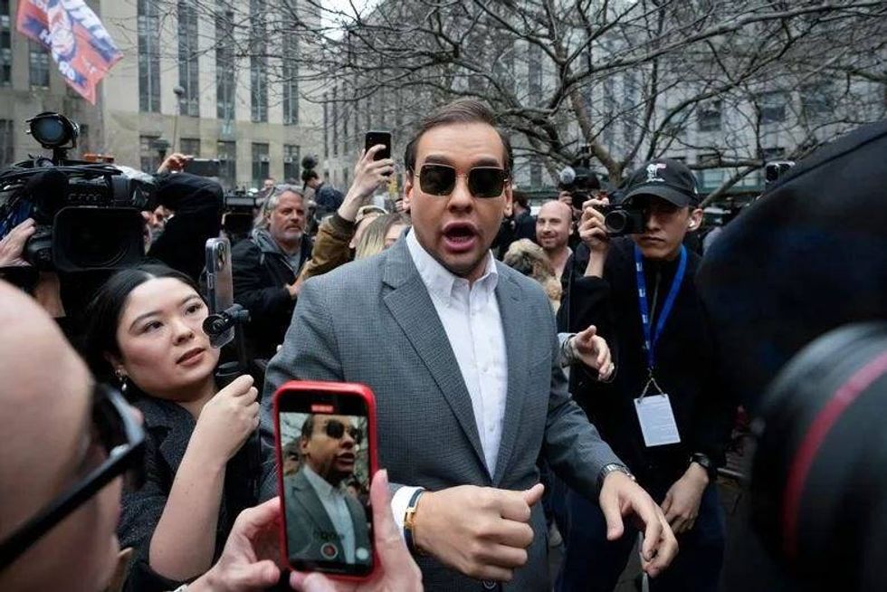 U.S. Rep. George Santos (R-NY) walks through the crowd gathered outside the courthouse on April 4, 2023.