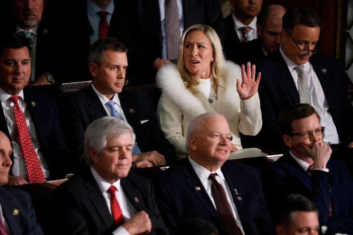 U.S. Rep. Marjorie Taylor Greene (R-GA) (C) reacts during President Joe Biden's State of the Union address during a joint meeting of Congress in the House Chamber of the U.S. Capitol on February 07, 2023 in Washington, DC. The speech marks Biden's first address to the new Republican-controlled House. (Photo by Chip Somodevilla/Getty Images)