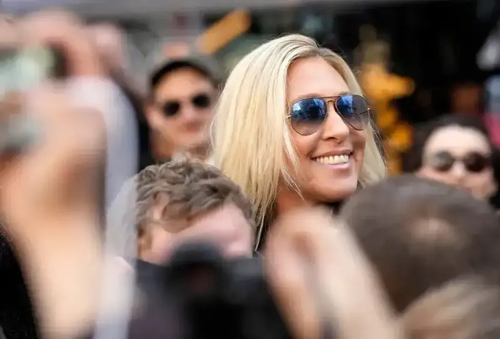 U.S. Rep. Marjorie Taylor Greene (R-GA) walks through the crowd gathered outside the courthouse on April 4, 2023.