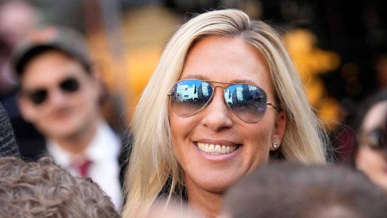 U.S. Rep. Marjorie Taylor Greene (R-GA) walks through the crowd gathered outside the courthouse where former U.S. President Donald Trump will arrive later in the day for his arraignment on April 4, 2023 in New York City. With his indictment, Trump will become the first former U.S. president in history to be charged with a criminal offense. (Photo by Drew Angerer/Getty Images)