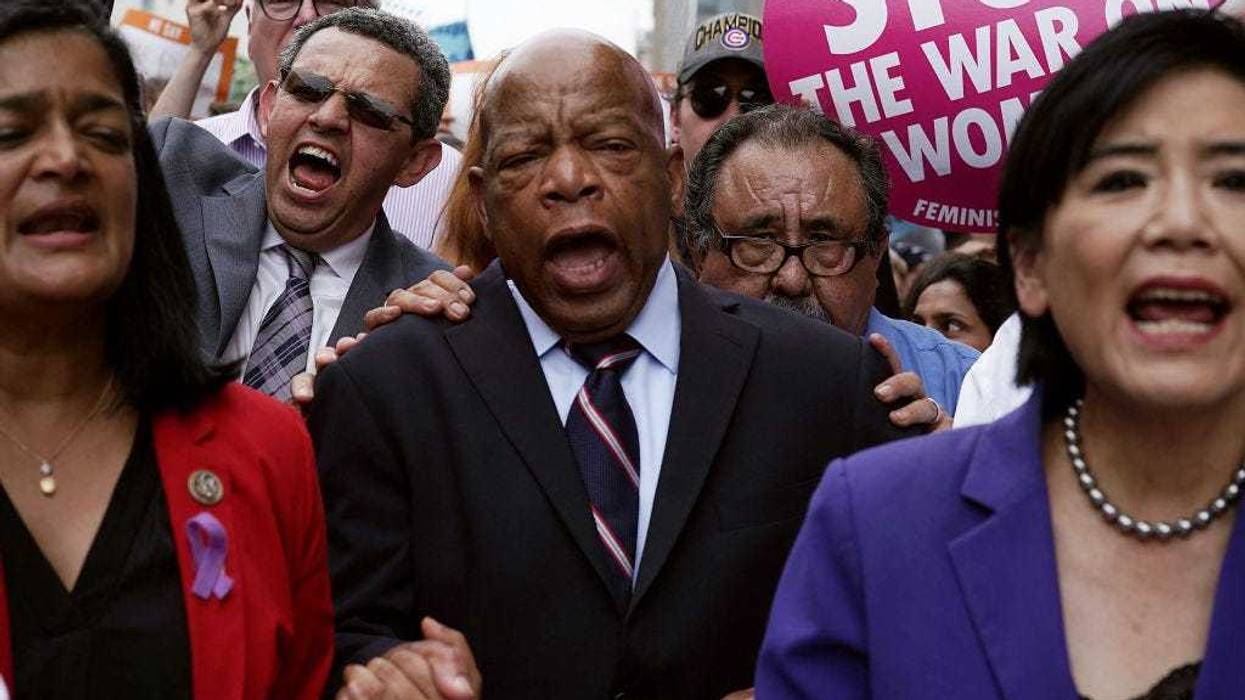 U.S. Rep. Pramila Jayapal (D-WA), President of CASA in Action Gustavo Torres, Rep. John Lewis (D-GA), Rep. Raul Grijalva (D-AZ) and Rep. Judy Chu (D-CA) march to the headquarters of U.S. Customs and Border Protection during a protest June 13, 2018 in Washington, DC. Democratic congressional members joined actives to protest "the Trump administration's policy to separate children from their parents at the border." (Photo by Alex Wong/Getty Images)