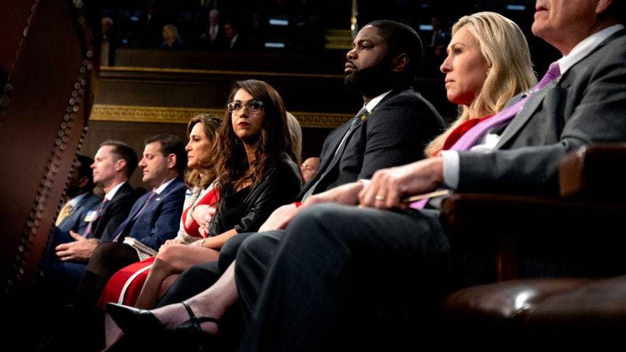 U.S. Reps. Lauren Boebert (R-CO) (C), Byron Donalds (R-FL) (3rd R) and Marjorie Taylor-Greene (R-GA) (2nd R) listen as President Joe Biden delivers the State of the Union address to a joint session of Congress in the U.S. Capitol House Chamber on March 1, 2022 in Washington, DC.