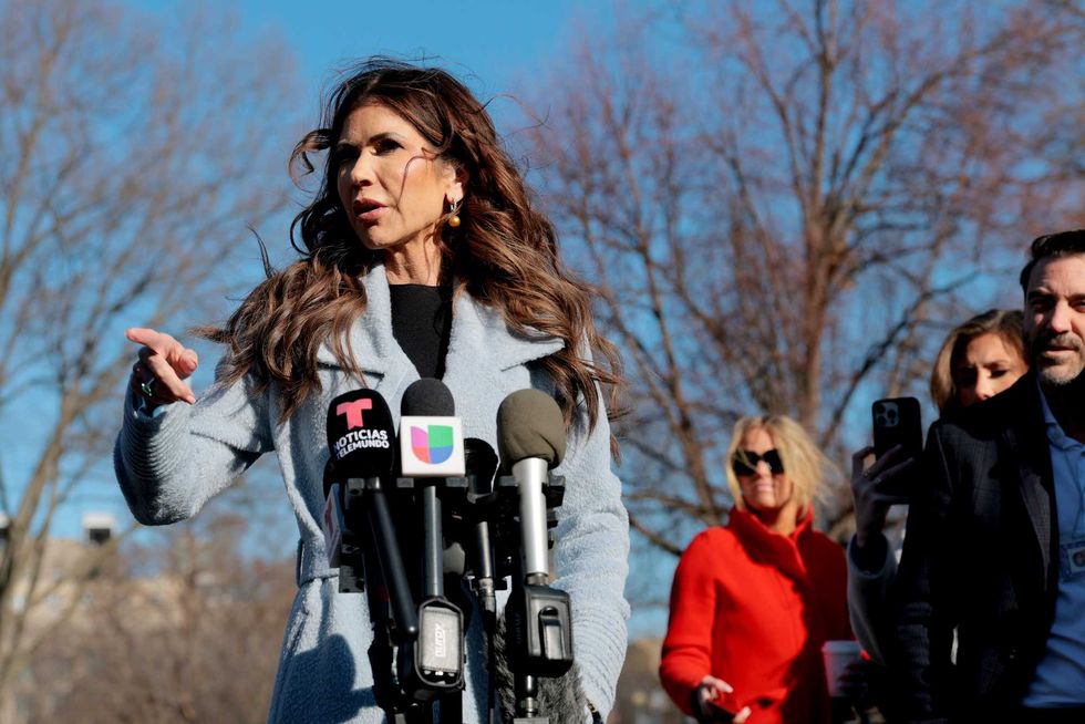 U.S. Secretary of Homeland Security Kristi Noem speaks to reporters after participating in a TV interview outside of the White House on January 15, 2026 in Washington, DC. Earlier this morning on Truth Social, U.S. President Donald Trump posted a warning that he may enact the Insurrection Act in response to rising tensions between protesters and federal agents in Minneapolis.