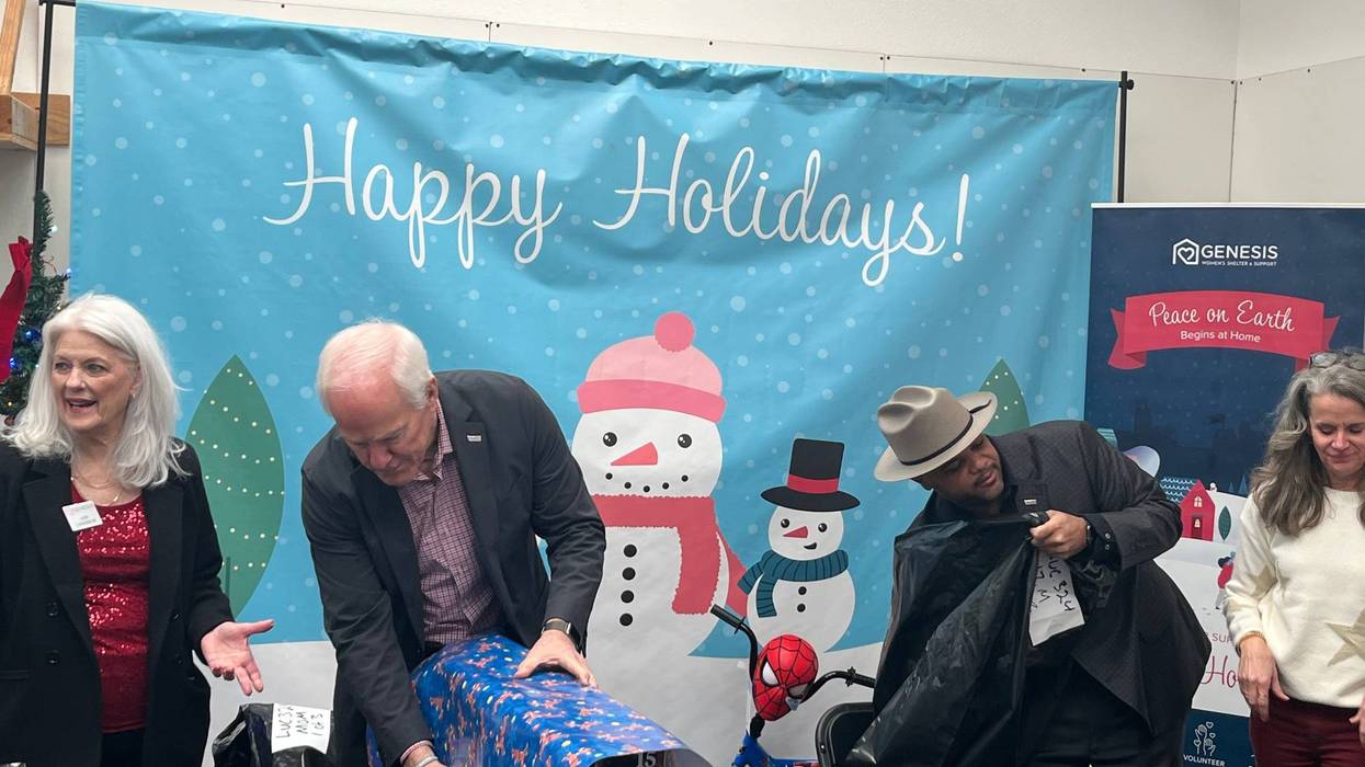 U.S. Sen. John Cornyn (R-TX) and Dallas Mayor Eric Johnson wrap gifts at a nonprofit in Dallas, Texas on Tuesday, Dec. 19, 2023.