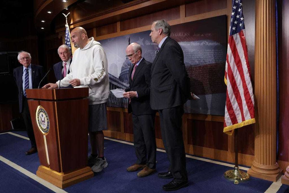 U.S. Sen. John Fetterman (D-PA) (3rd L) speaks as (L-R) Sen. Bernie Sanders (I-VT), Sen. Ed Markey (D-MA), Sen. Peter Welch (D-VT) and Sen. Jeff Merkley (D-OR) listen during a news conference on debt limit at the U.S. Capitol on May 18, 2023 in Washington, DC.