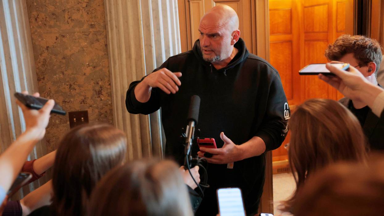 U.S. Sen. John Fetterman (D-PA) speaks to reporters outside of the Senate Chambers at the U.S. Capitol on March 13, 2025 in Washington, D.C.