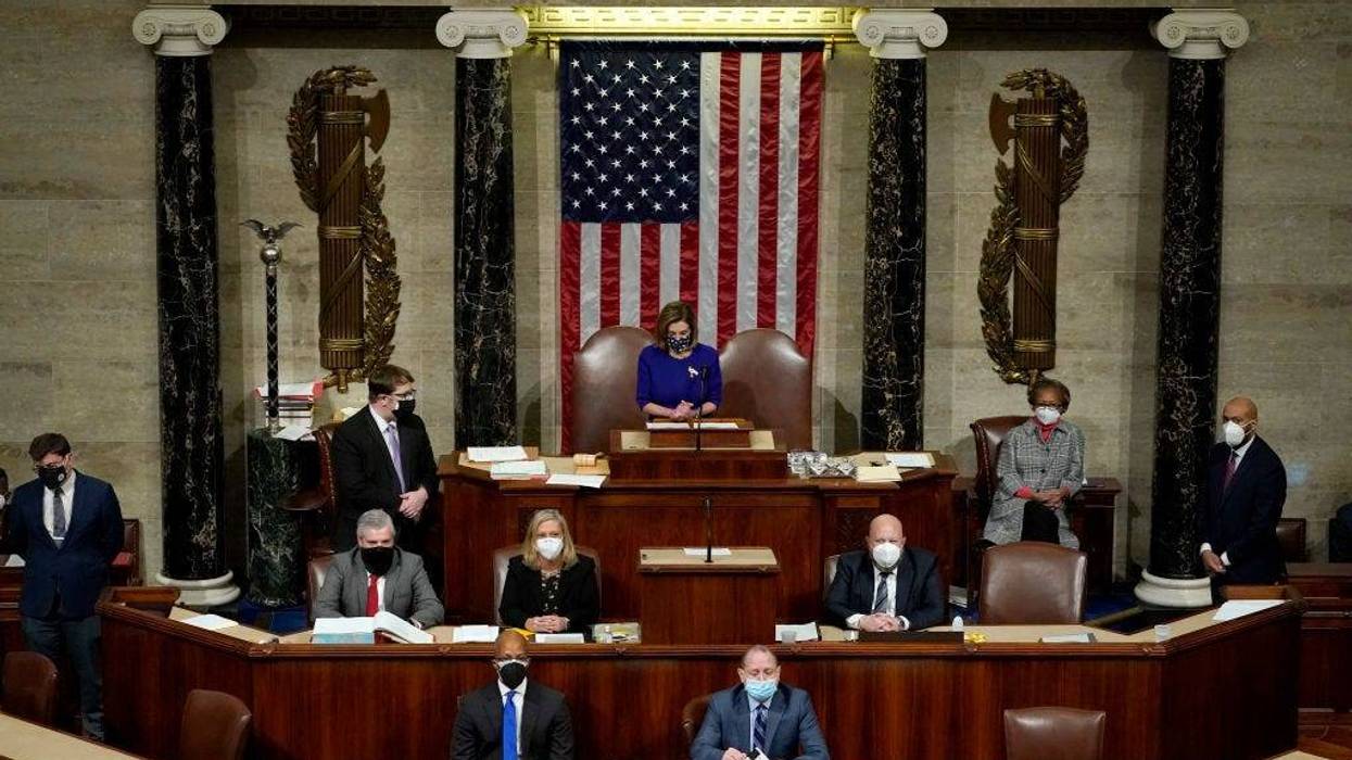 U.S. Speaker of the House Nancy Pelosi (C) (D-CA) speaks in the House Chamber during a reconvening of a joint session of Congress on January 06, 2021 in Washington, DC. Members of Congress returned to the House Chamber after being evacuated when protesters stormed the Capitol and disrupted a joint session to ratify President-elect Joe Biden's 306-232 Electoral College win over President Donald Trump.