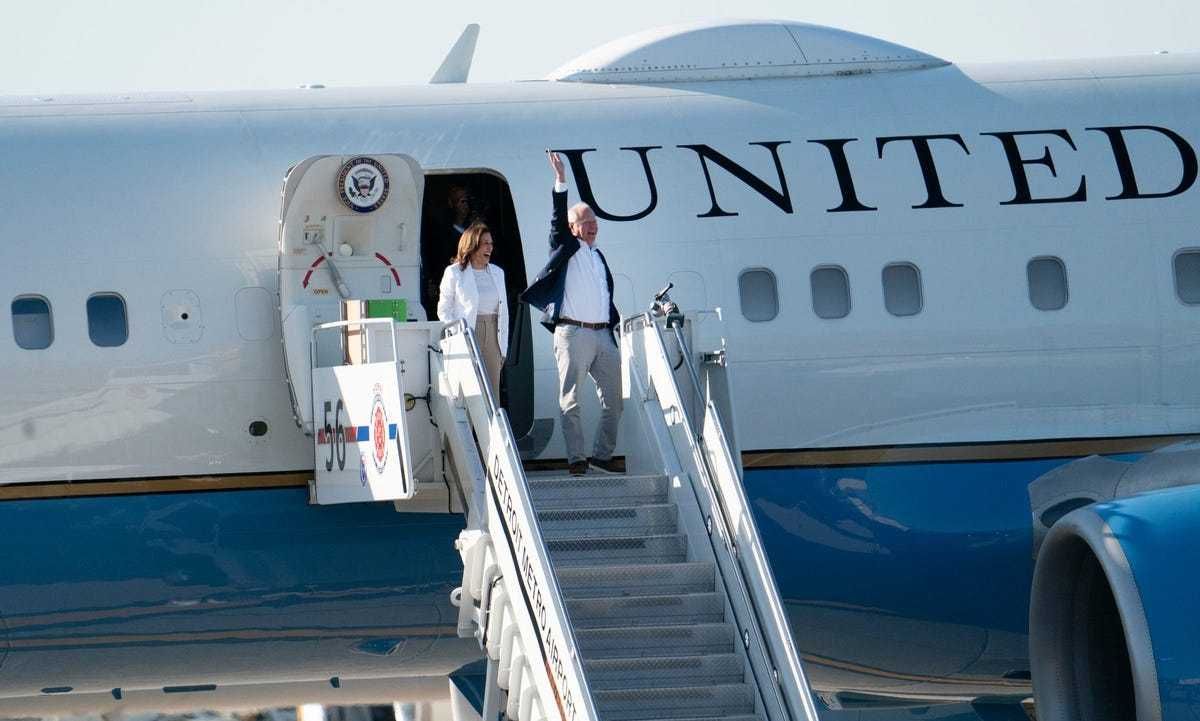 U.S. Vice President and democratic candidate for U.S. president Kamala Harris departs Airforce II with her chosen running mate Minnesota Gov. Tim Walz during a campaign stop in Romulus on Wednesday, Aug. 7, 2024.