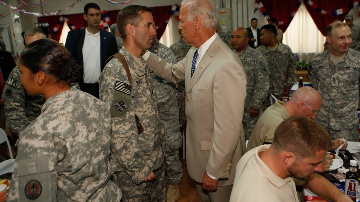 U.S. Vice President Joe Biden talks with his son U.S. Army Capt. Beau Biden (L) at Camp Victory on July 4, 2009 near Baghdad, Iraq. Bidden's first visit to Iraq as the Vice President comes days after U.S. forces pulled out from Iraq's cities.
