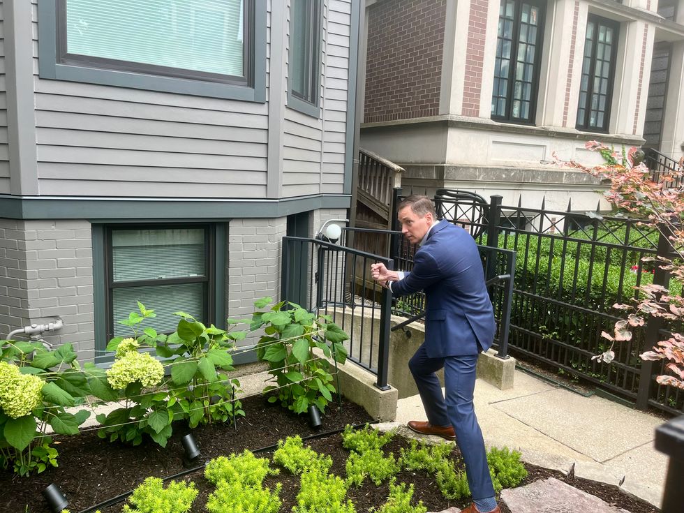 \u200bLeo Feler speaking to reporters outside of his home on Lakewood Avenue
