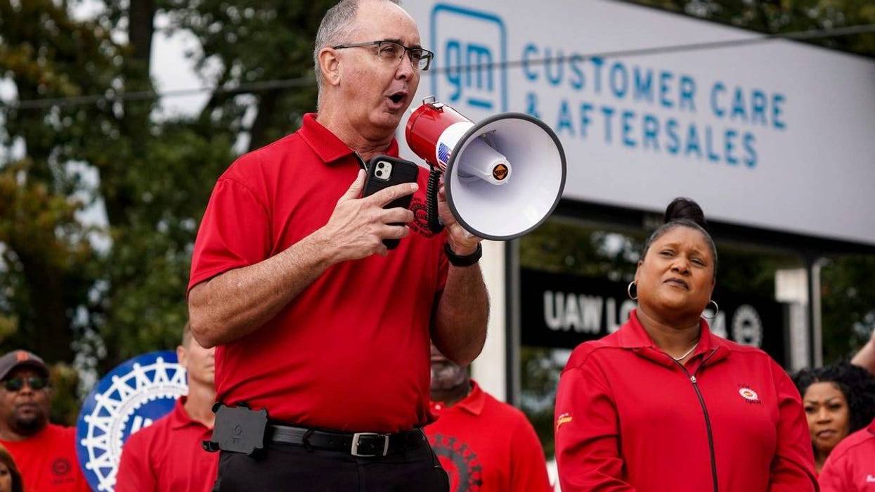 UAW President Shawn Fain talks to members as President Joe Biden visits on Tuesday, Sept. 26