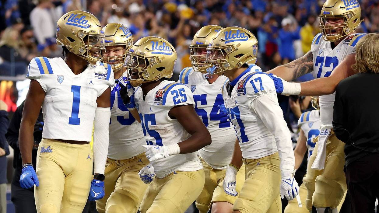 ucla football players on field