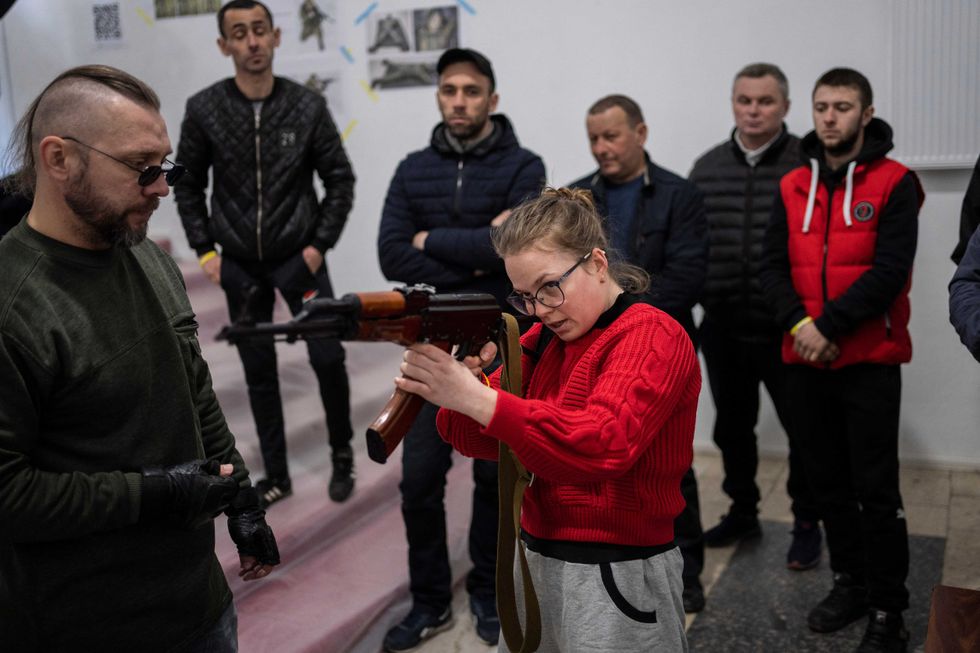 Ukrainian civilians receive weapons training