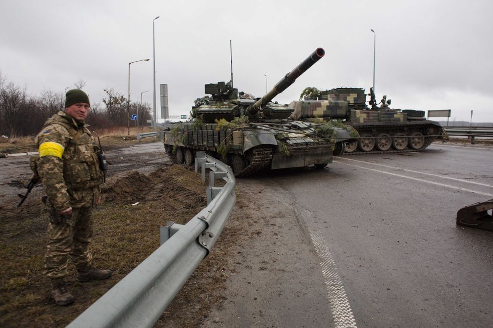 Ukrainian servicemen take an APC for repairs on March 3, 2022 in Sytniaky, Ukraine, west of the capital