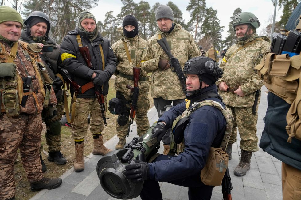 Ukrainian Territorial Defence Forces members train to use an NLAW anti-tank weapon on the outskirts of Kyiv, Ukraine, Wednesday, March 9, 2022