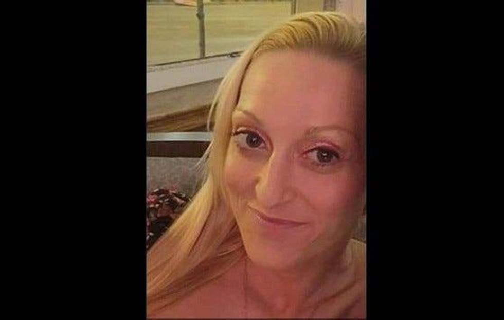 Undated photo of 33-year-old Mollie Schmidt, mother of 5, who was found slain in an apartment on the state