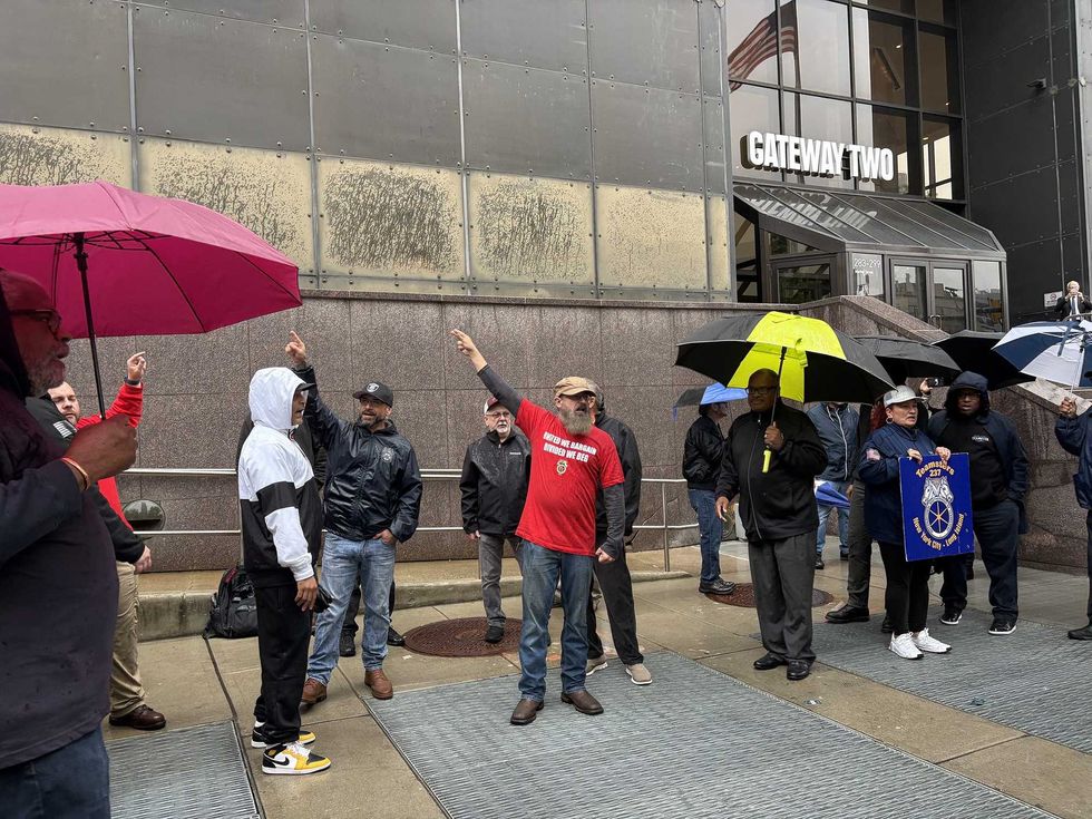 Union members demonstrate outside of NJ Transit