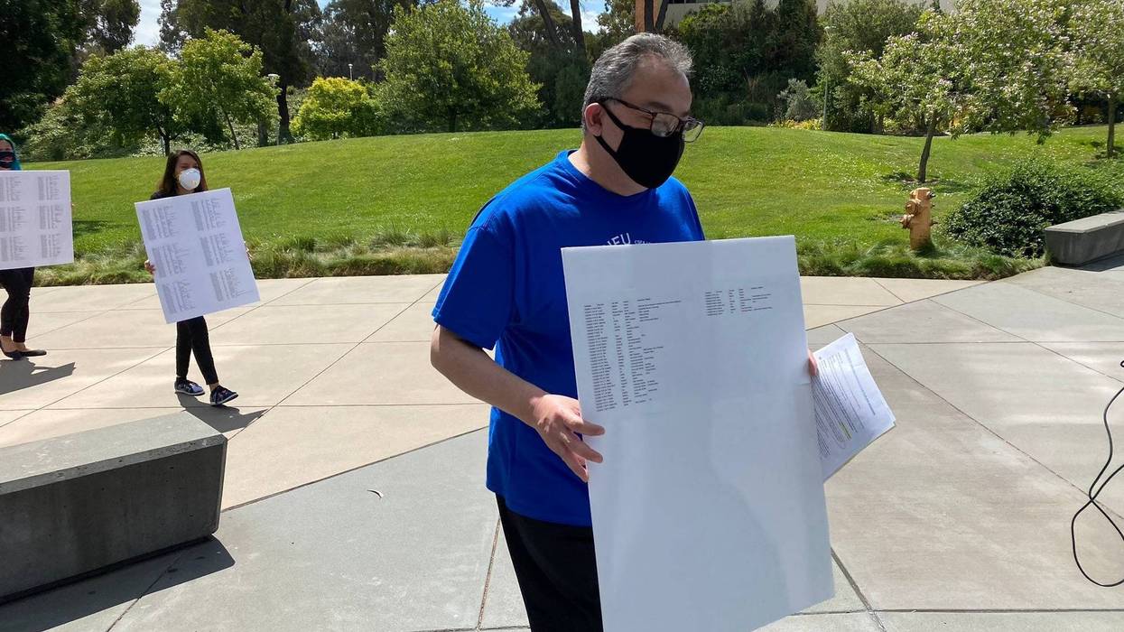 Union reps deliver a petition of over 1,000 signatures to CSU East Bay administrators.