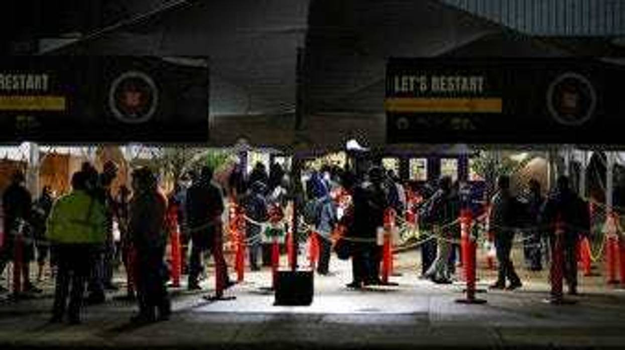 United Auto Workers return for the first work shift at the FCA Warren Truck Plant, Monday, May 18, 2020, in Warren, Mich. (AP Photo/Carlos Osorio)