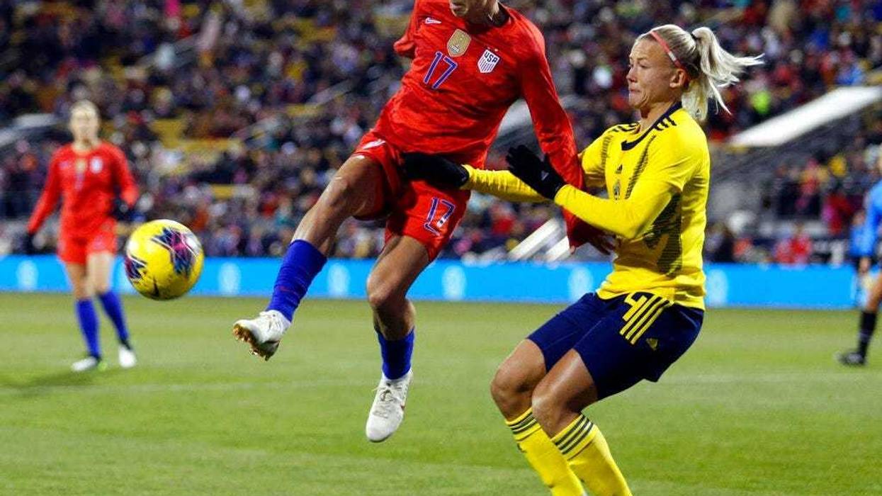 United States forward Tobin Heath, left, passes the ball in front of Sweden defender Hanna Glas during the first half of a women's international friendly soccer match in Columbus, Ohio, Thursday, Nov. 7, 2019.