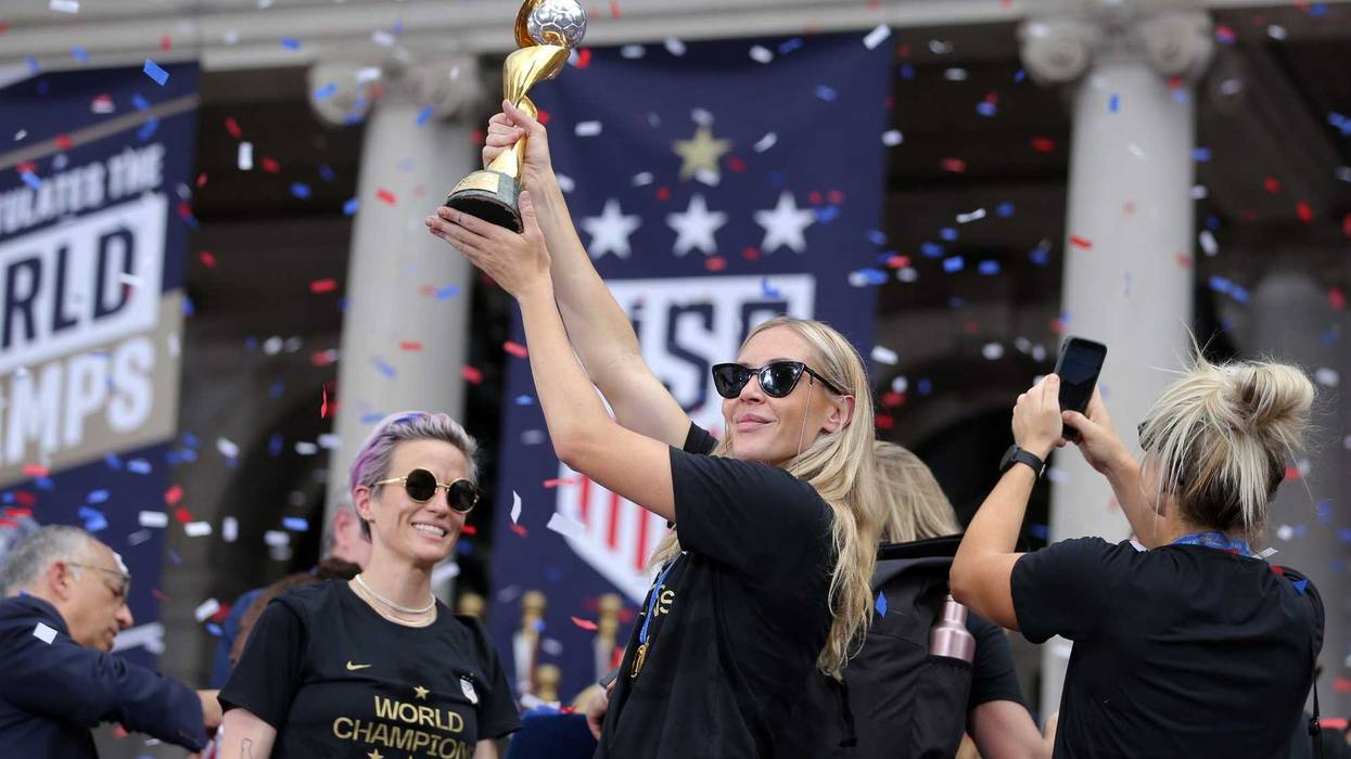United States women's national soccer team midfielder Allie Long (20) celebrates with the trophy at New York City Hall after the ticker-tape parade for the United States women's national soccer team down the canyon of heroes in New York City