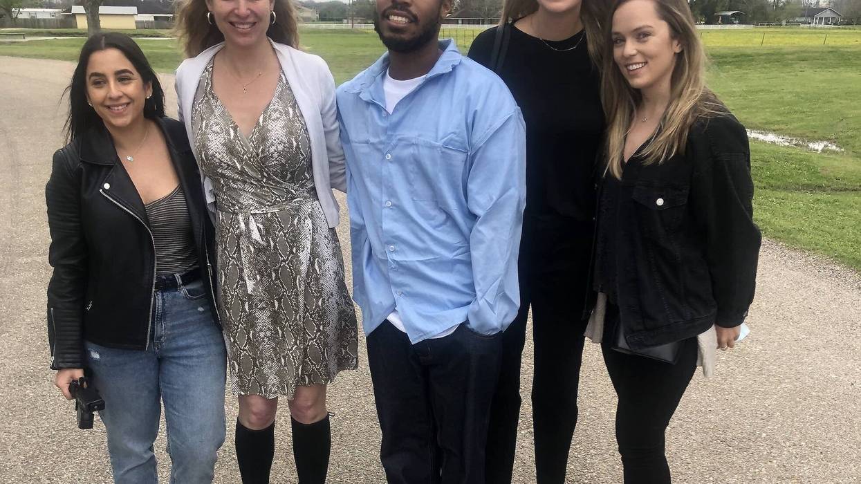 University of San Francisco students and law professor Lara Brazelon with former inmate Yutico Briley.