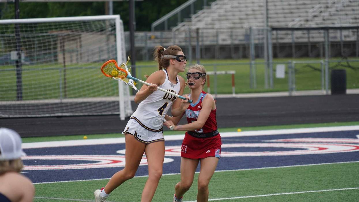 University School of MIlwaukee attacker Darcy Doyle looks for a passing lane while being defended by Arrowhead's Hailey Jordan during the Wildcats' 15-10 sectional final win on June 4, 2024.