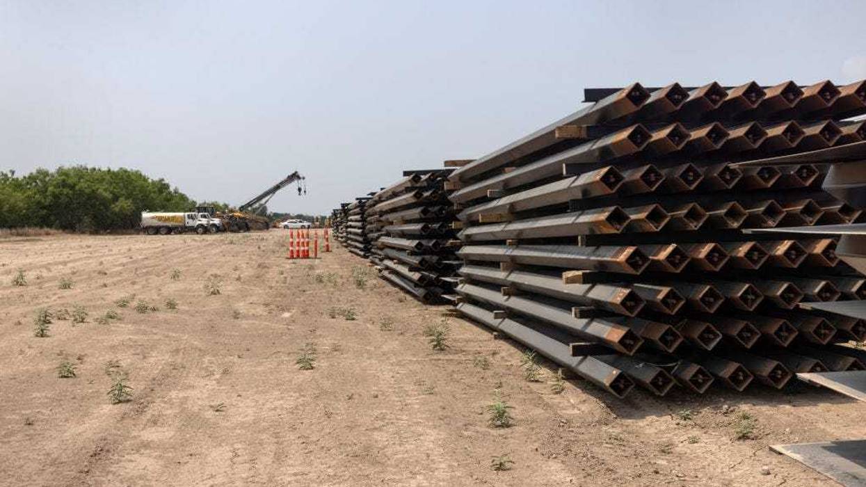 Unused pieces of steel bollard-style wall lay near a portion of unfinished border wall at the U.S.-Mexico border on April 14, 2021 in La Joya, Texas.