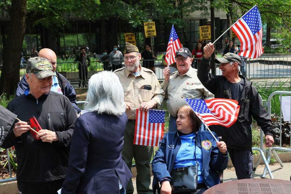 upporters of Daniel Penny wave flags as they attend a rally in support of Penny at Collect Pond Park on May 24, 2023 in New York City.