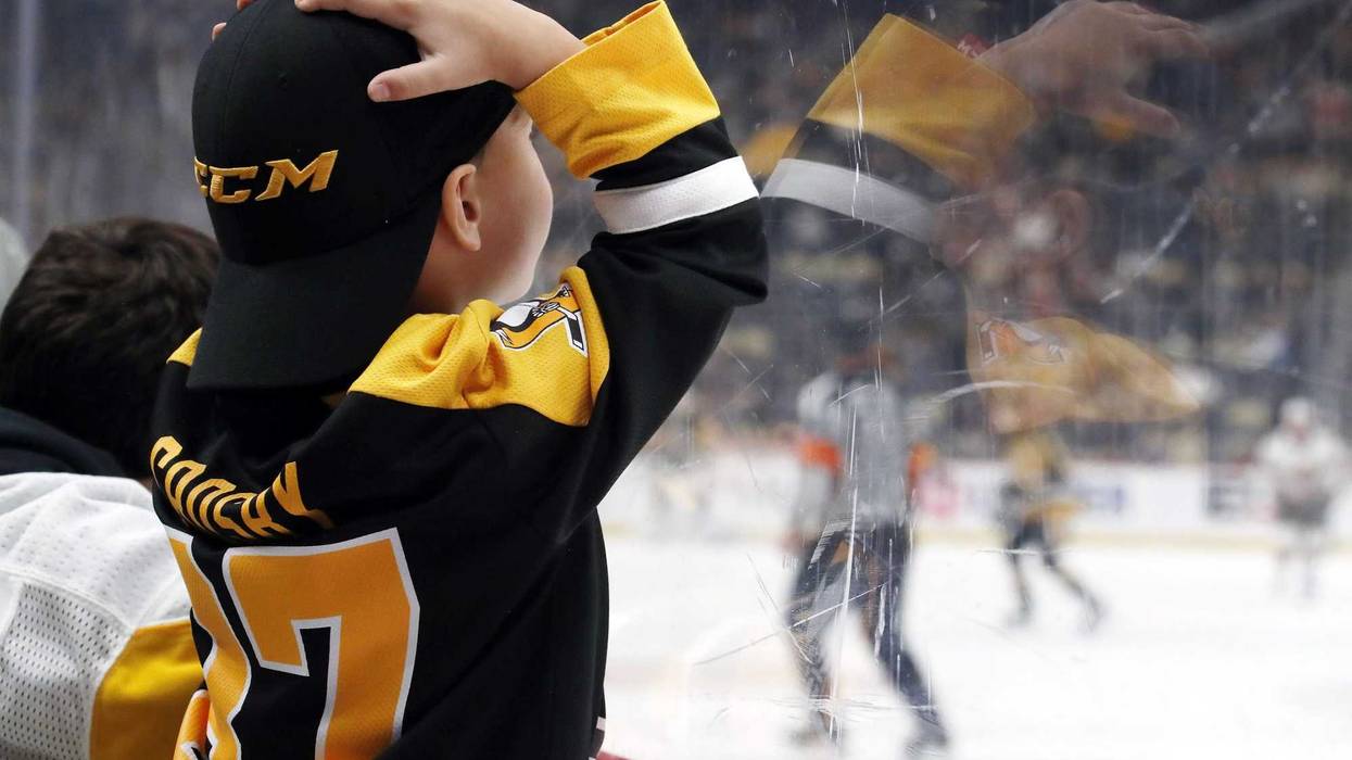 Upset young Pens fan