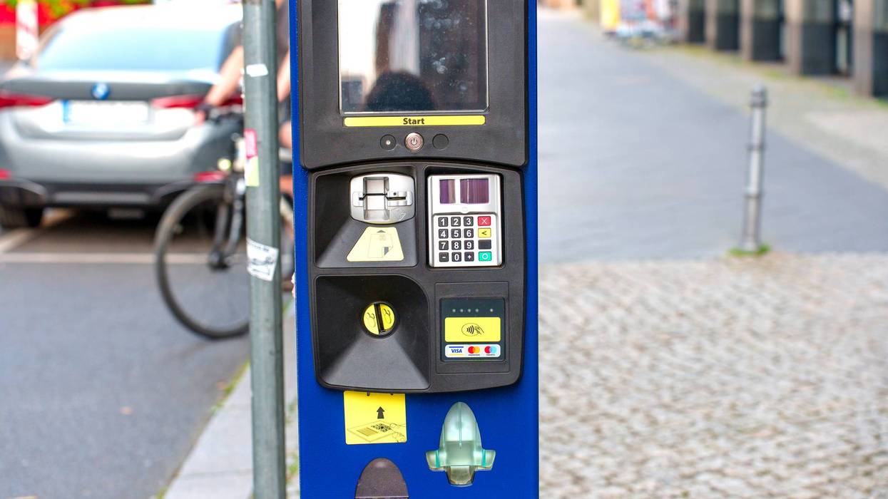 Urban Parking Meter in Berlin with Cobblestone Street View