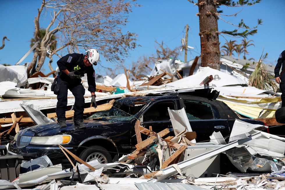 Urban search and rescue workers look for victims who may have lost their lives during Hurricane Ian in Fort Myers, Florida, on Wednesday, October 5, 2022.
