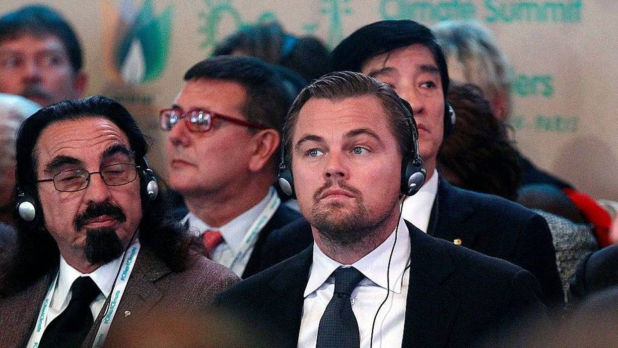 US actor Leonardo DiCaprio (R) and his father George DiCaprio (L) attend a Summit of Local elected for Climate at the Paris city hall on December 04, 2015 in Paris, France.